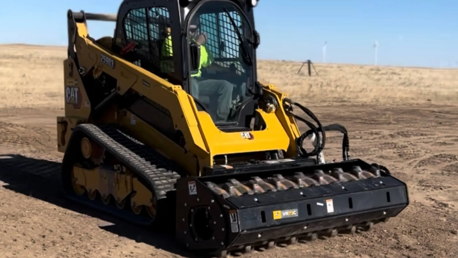 Wieser Construction tracked skid steer grading a project site